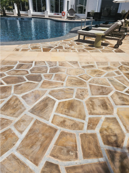 Restored natural stone paving beside the pool at Al Areen Spa and Resort