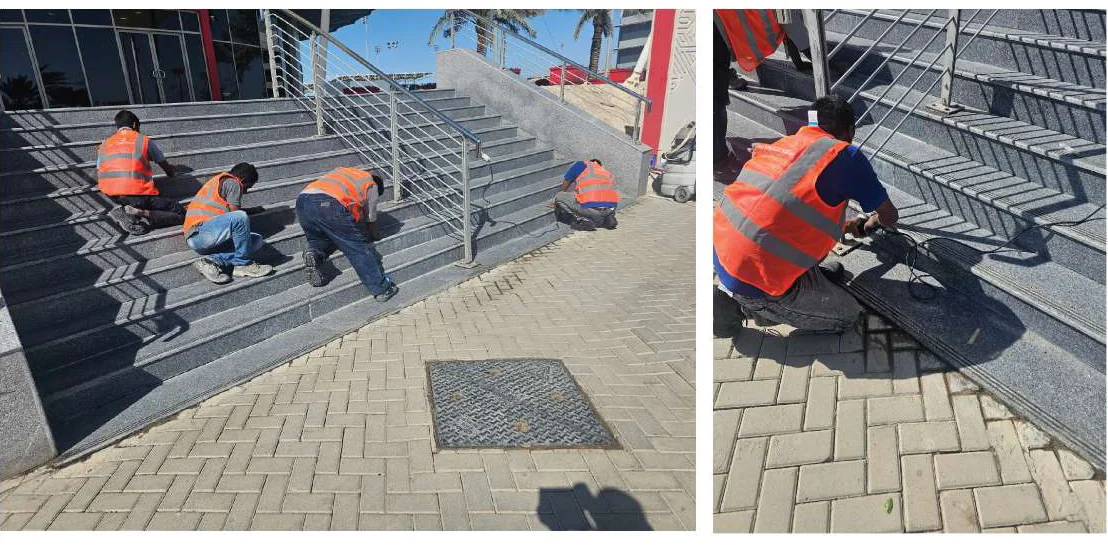 Technicians restoring the stone steps at the Formula One VIP entrance