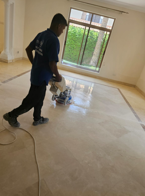 Skill Line technician polishing a marble floor at Wasna Garden Kanoo