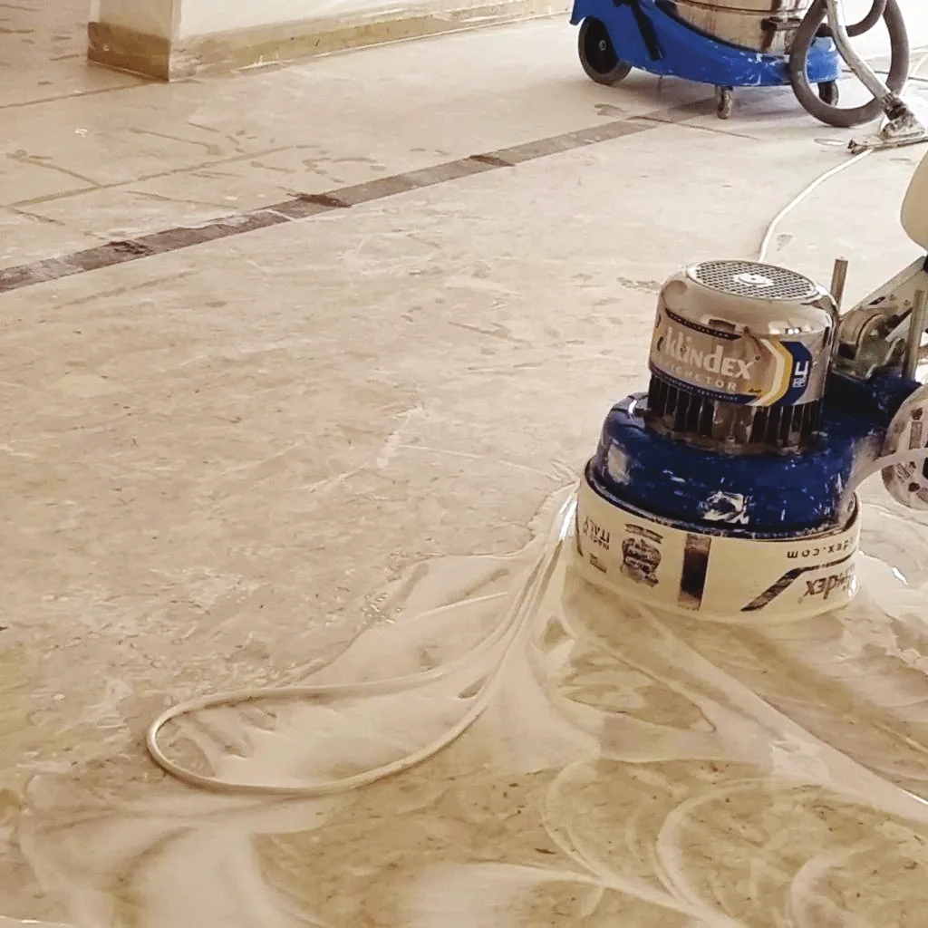 Floor restoration machine polishing a natural stone surface